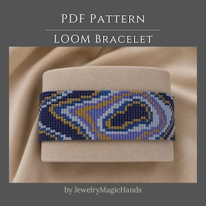 May include: A PDF pattern for a loom bracelet featuring a geometric design with repeating wavy bands of dark blue, light blue, purple, and gold beads. The text PDF PATTERN LOOM BRACELET and by JewelryMagicHands are visible on the image.