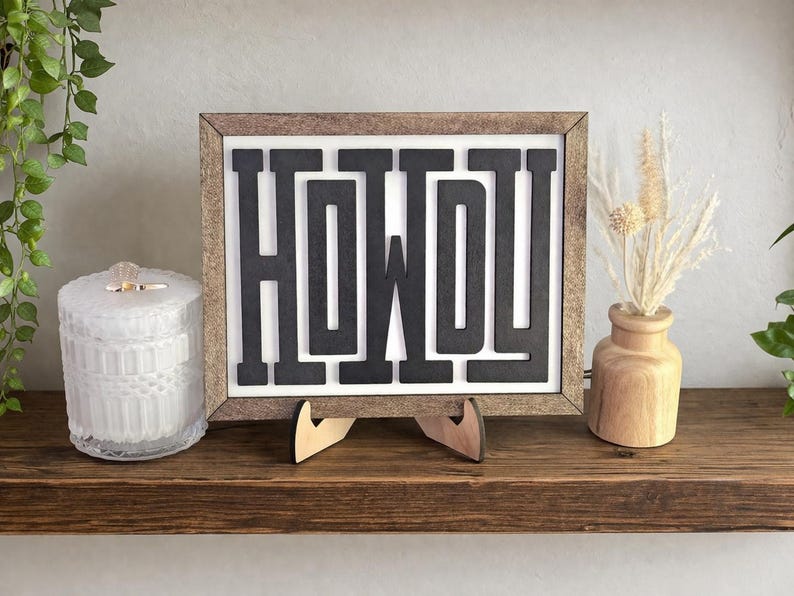 May include: A set of three ceramic mugs with a speckled, matte finish. The mugs are in shades of cream, light gray, and dark gray. Each mug has a simple, minimalist design and a rounded handle.
