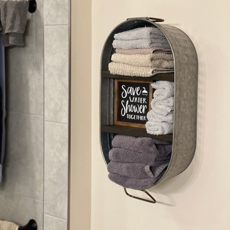 Galvanized Washtub with shelves stained in a dark walnut stain with two shelves and hung on the wall in your rustic farmhouse bathroom and or laundry room!