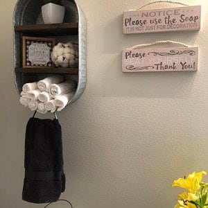 Galvanized Washtub with shelves stained in a dark walnut stain with two shelves and hung on the wall in your rustic farmhouse bathroom and or laundry room!