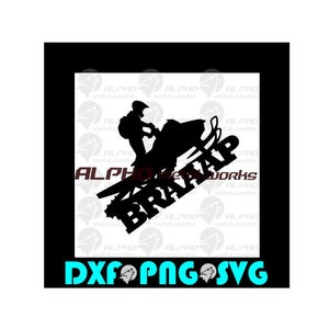 May include: Black silhouette of a person riding a snowmobile, with the text "BRAAAP WORKS" and "ALPHA" in a stylized font. The image also includes the text "DXF PNG SVG" in a teal color, suggesting digital design files.