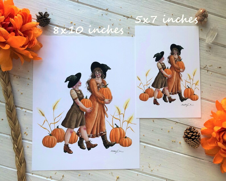 May include: Two witches in black hats and brown and orange dresses carry pumpkins in a field of wheat. The print is available in two sizes: 8x10 inches and 5x7 inches.