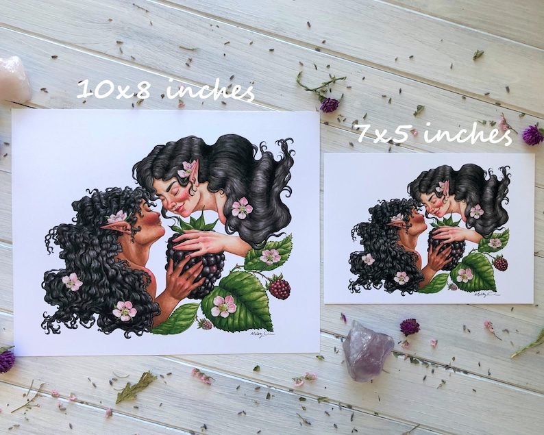 May include: Two women with long black hair are depicted in a watercolor illustration. They are embracing and holding a blackberry. The background features green leaves and pink flowers. The print is available in two sizes: 10x8 inches and 7x5 inches.