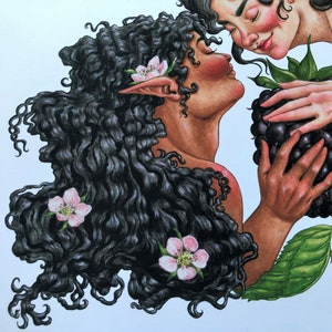 May include: Two women with long, dark hair, one with pink flowers in her hair, are looking at each other. The woman on the right is holding a large blackberry.