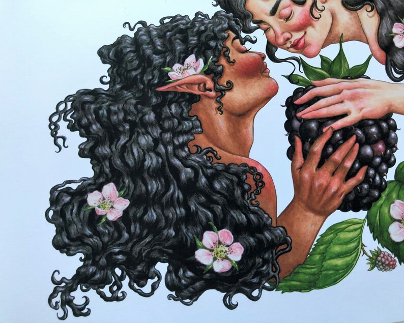 May include: Two women with long, dark hair, one with pink flowers in her hair, are looking at each other. The woman on the right is holding a large blackberry.
