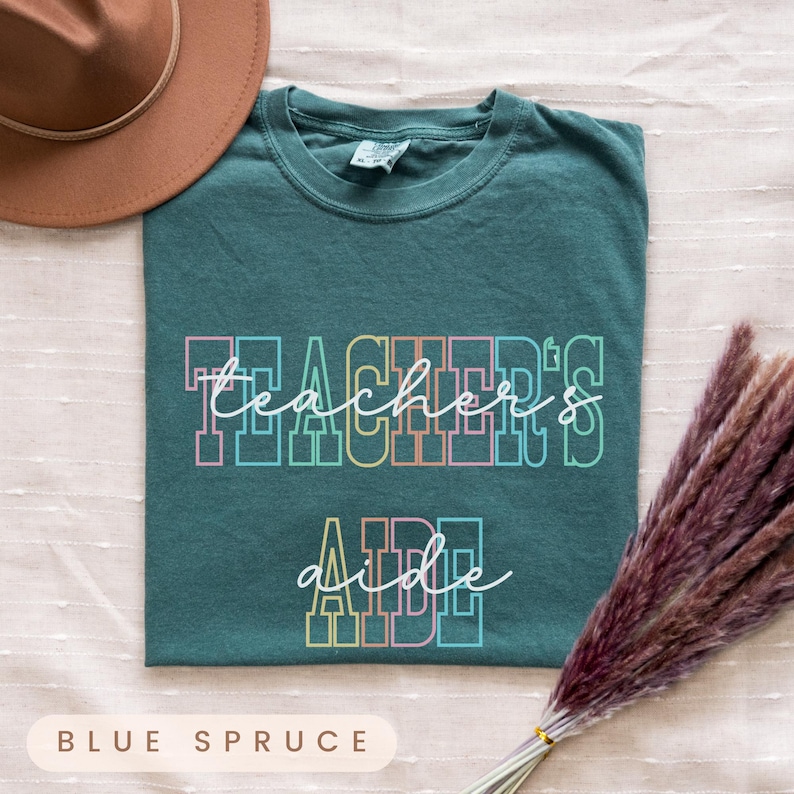 a t - shirt that says teachers are awesome with a hat on top of it