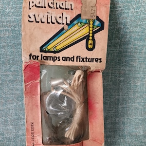 May include: A white and red package with a pull chain switch for lamps and fixtures. The package has the text "pull chain switch" and "for lamps and fixtures". The package also has a UL listed label with the number 808B.