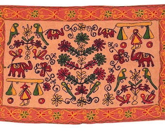May include: A pink fabric wall hanging with a colorful embroidered design featuring birds, elephants, flowers, and leaves.