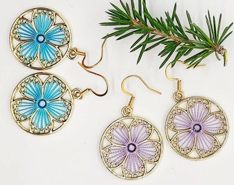 Round gold circle dangle earrings with purple or blue flower charm, pretty floral jewellery for women, mixed material drop earrings for her