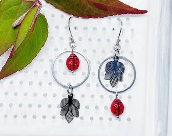 Ladybird asymmetrical earrings with open circles and leaf charms,  Mismatched dangle earrings with ladybugs, unique asymmetric earrings uk