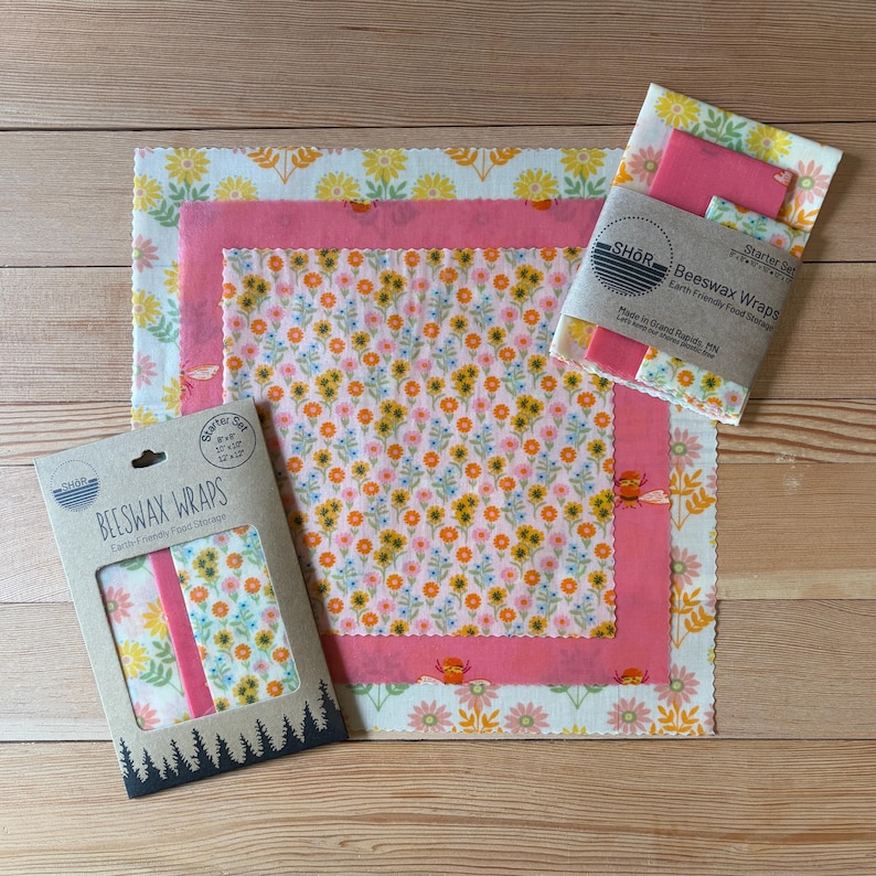 Beeswax Wrap Starter Set 3 pack with yellow and pink patterns with flowers and bumblebees.