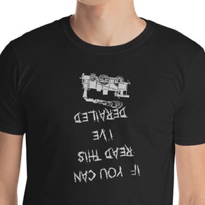 May include: Black t-shirt with white text that reads "If you can read this I've derailed". The text is upside down. A graphic of a train car is above the text.