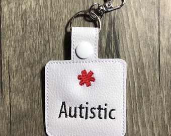 Llavero de concienciación médica sobre el autismo: etiqueta para bolso con cierre giratorio