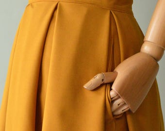 SUK Pleated Skirt. This item is handmade from VERY stretchy gabardine fabric. Solid color.