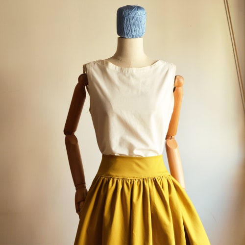 SUNFLOWER, shops curled, in pure solid color cotton. It will go elegant, going elegant, going in cotton, maxi going, going round