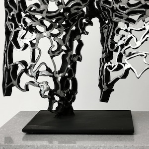 Viol Entwined Reflections: Handcrafted Metal Female Back Sculpture image 2