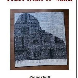 May include: A black and white piano quilt with the text "WANAQLT I just want to Quilt!" and "Piano Quilt Lap Quilt 58" x 66" Finished".