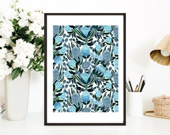 May include: A framed print with a blue and green floral pattern. The pattern features stylized flowers and leaves on a white background.
