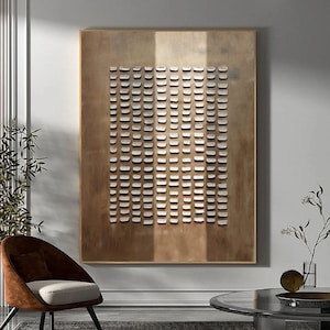 May include: A large abstract painting with a grid pattern of white squares on a brown background. The painting is framed in a thin gold frame.