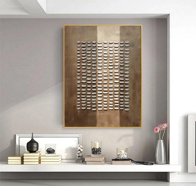 May include: A framed abstract art print with a geometric pattern of small white squares on a brown background.