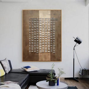 May include: A large abstract wall art piece with a brown background and a grid of white squares. The art is framed in a thin, light wood frame.