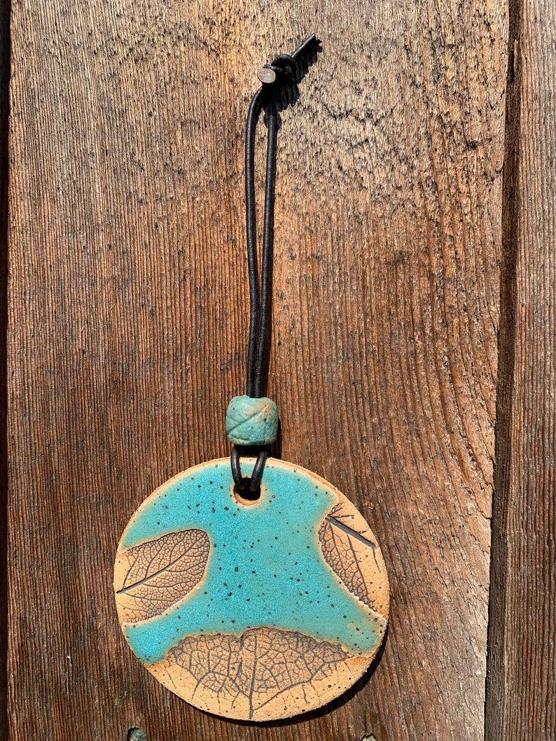 Free shipping Hand made ceramic ornament with leaf imprints and bead