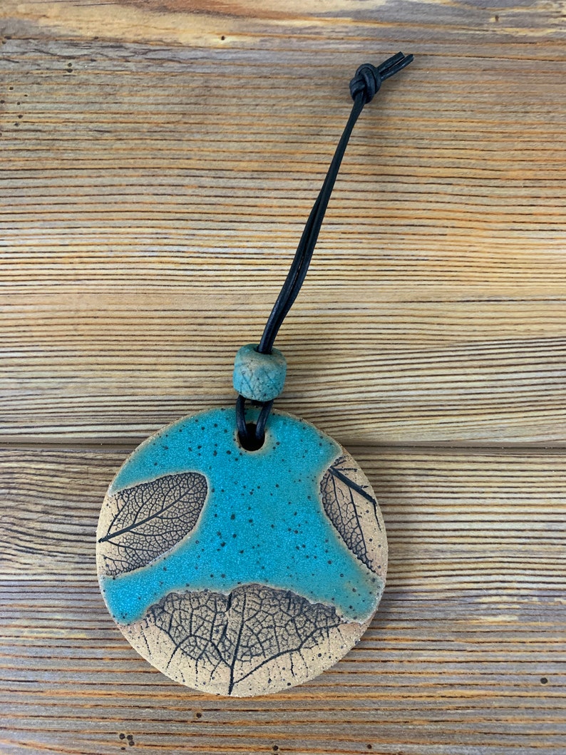 Free shipping Hand made ceramic ornament with leaf imprints and bead