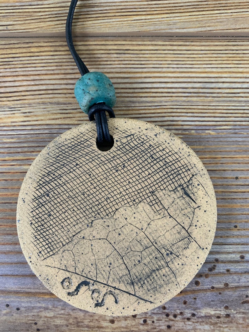 Free shipping Hand made ceramic ornament with leaf imprints and bead