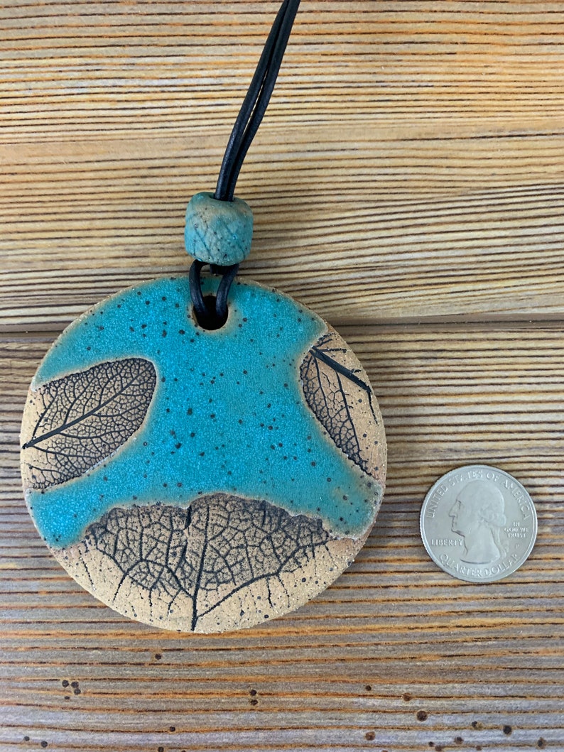 Free shipping Hand made ceramic ornament with leaf imprints and bead