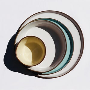 plates in natural lighting with white turquoise and yellow glaze