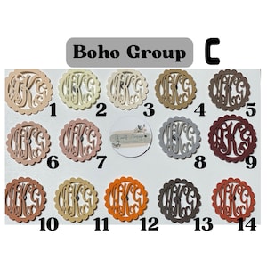May include: Fourteen wooden monogrammed ornaments in various colors, including beige, brown, orange, and gray. Each ornament features a scalloped edge and a single letter "K" in a decorative font. The ornaments are numbered 1 through 14.