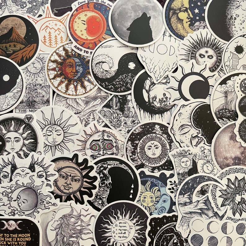 May include: A collection of black and white stickers featuring celestial and moon phases, sun and moon symbols, and other celestial imagery. The stickers are printed on white paper and have a glossy finish.