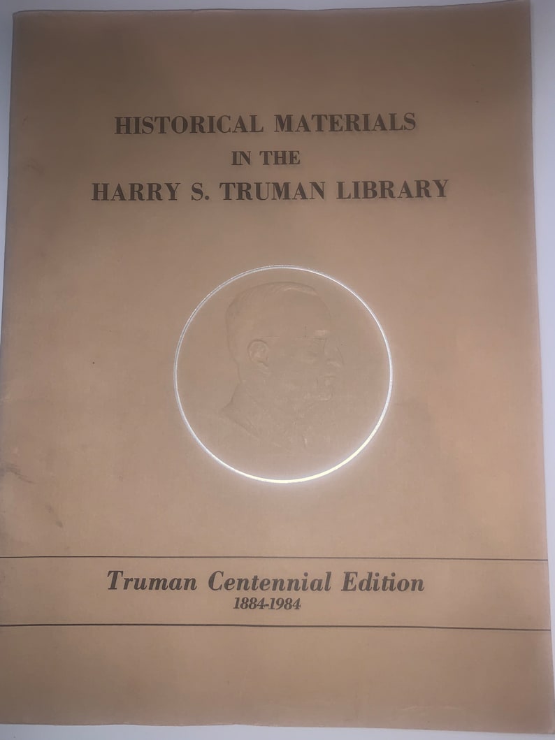 May include: A tan booklet with the title "Historical Materials in the Harry S. Truman Library" and a black and white image of Harry S. Truman. The booklet also says "Truman Centennial Edition 1884-1984".