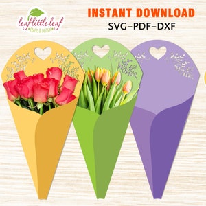 以下が含まれることがあります： 黄色、緑、紫の3つの印刷可能なフラワーコーンテンプレート。各コーンは、上部にハート型の切り抜きと装飾的な花のデザインがあります。画像の上部には「INSTANT DOWNLOAD SVG-PDF-DXF」というテキストがあります。