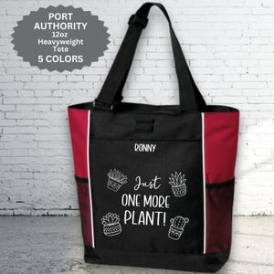 May include: Black and red tote bag with white accents and a black strap. The bag features the text "Just ONE MORE PLANT!" and plant illustrations. The bag also has the name "RONNY" printed on it.