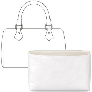 May include: A white fabric bag with a rectangular shape and a slightly curved top. The bag is designed to fit inside a larger handbag.