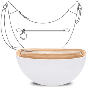 May include: White leather handbag with a crescent shape and a zipper closure. The bag has a brown lining and a silver ring attached to the zipper.