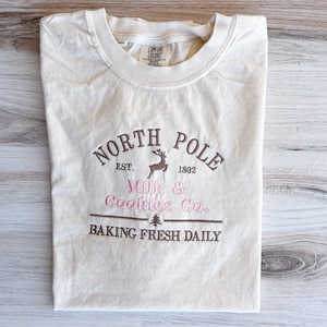 North Pole Comfort Colors Tee, Christmas Embroidered Shirt, Milk And Cookies Christmas T-Shirt, Winter Tee, Embroidered Shirt, Holiday Tee