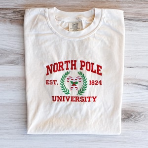 North Pole Comfort Colors Tee, Christmas Embroidered Shirt, Christmas T-Shirt, Winter Tee, Embroidered Shirt, Candy Canes Shirt, Holiday Tee