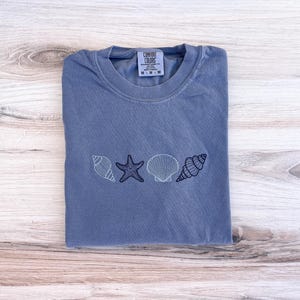 SeaShell Comfort Colors Tee, Beach Shirt, Tropical T-Shirt, Embroidered Tee, Embroidered Shirt, Ocean Shirt, Oversized Shirt, Summer Tee