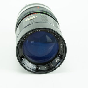 Soligor Auto-Zoom 55-135mm F3.5 Lens with Integrated Lens Hood T4 Mount with Minolta MC/MD Mount Adaptor