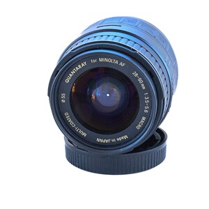 May include: A Quantaray lens for Minolta AF, with a 28-90mm focal length and f/3.5-5.6 aperture. The lens is multi-coated and has a 55mm diameter. The lens is black and has the text "Made in Japan".