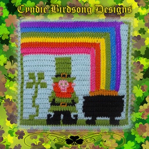 May include: A crocheted square featuring a leprechaun holding a pot of gold at the end of a rainbow. The leprechaun is wearing a green hat and has a red beard. The rainbow is made of different colored yarn.