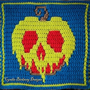May include: A crocheted square featuring a yellow skull design with red eyes and mouth, set against a blue background. The skull has a brown stem. The text "Cyndie Birdsong Designs" is at the bottom.
