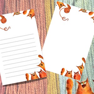 May include: Two white sheets of paper with a lined border and a whimsical illustration of orange cats playing with a ball of yarn. The text "ces" is written on the top of the left sheet.