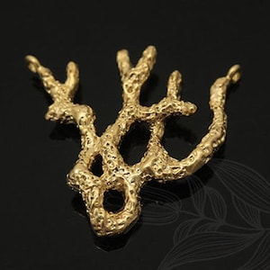 May include: Gold-toned metal pendant shaped like a coral branch with a textured surface.