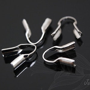 May include: Five silver metal crimp end caps for jewelry making.