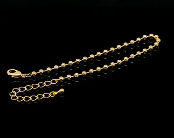 Puede incluir: Un extensor de cadena de collar de oro con un cierre de langosta y una cadena de bolas. El extensor mide aproximadamente 5 cm de largo.