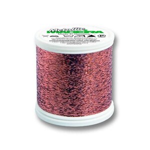 May include: A spool of Madeira Metallic thread in a copper color. The spool is labeled "Madeira Metallic" and "Made in Germany".