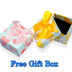 May include: Two small gift boxes with heart patterns and satin bows. One box has a pink bow, the other a yellow bow. The boxes are open, revealing a black interior. Text at the bottom reads "Free Gift Box".
